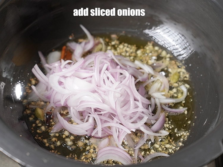 Step 9 – <p>Add <span style="background-color:rgb(255,255,255);color:rgb(0,0,0);">1 1/2 cups </span><a href="https://www.tarladalal.com/glossary-onions-pyaz-pyaaz-kanda-548i#ing_2342"><u>sliced onions</u></a><u>.</u></p>