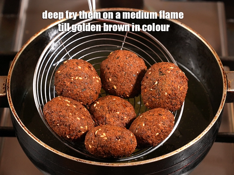 Step 14 – <p><span style="background-color:rgb(255,255,255);color:rgb(0,0,0);">Deep fry them on a medium flame till golden brown in colour.</span></p>