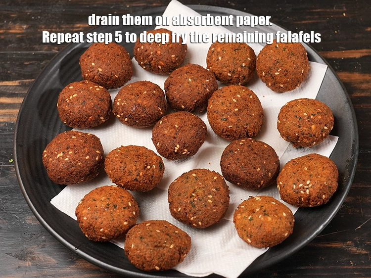 Step 15 – <p><span style="background-color:rgb(255,255,255);color:rgb(0,0,0);">Drain them on absorbent paper. Repeat step 5 to deep fry the remaining falafels.</span></p>