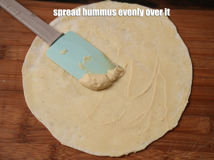 Step 27 – <p><span style="background-color:rgb(255,255,255);color:rgb(0,0,0);">Spread the <strong>hummus</strong> evenly over it.</span></p>