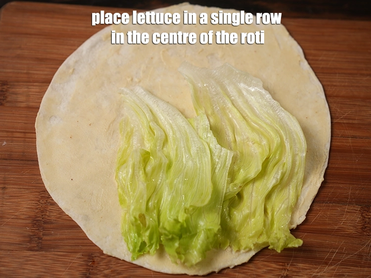 Step 28 – <p><span style="background-color:rgb(255,255,255);color:rgb(0,0,0);">Place the </span><a href="https://www.tarladalal.com/glossary-lettuce-salad-ke-patte-498i"><u>lettuce</u></a><span style="background-color:rgb(255,255,255);color:rgb(0,0,0);"> in a single row in the centre of the …