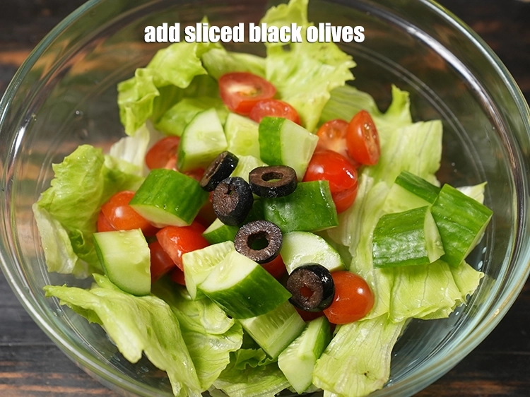 Step 12 – <p><span style="background-color:rgb(255,255,255);color:rgb(0,0,0);">Add 5 </span><a href="https://www.tarladalal.com/glossary-sliced-black-olives-1069i"><u>sliced black olives</u></a>.</p>