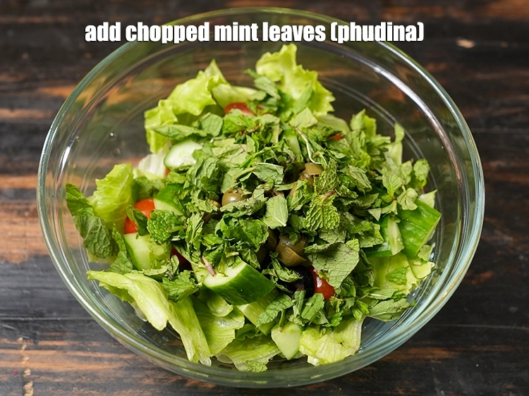 Step 14 – <p>Add <span style="background-color:rgb(255,255,255);color:rgb(0,0,0);">1/2 cup </span><a href="https://www.tarladalal.com/glossary-mint-leaves-pudina-phudina-521i#ing_2368"><u>chopped mint leaves (phudina)</u></a><u>.</u></p>