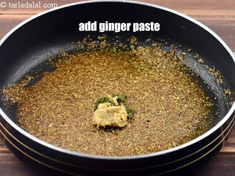 Step 13 – <p><span style="background-color:rgb(255,255,255);color:rgb(0,0,0);">Add 1 tsp </span><a href="https://www.tarladalal.com/glossary-ginger-green-chilli-paste-adrak-mirch-ki-paste-adrak-mirchi-paste-139i"><u>ginger-green chilli paste</u></a>.</p>