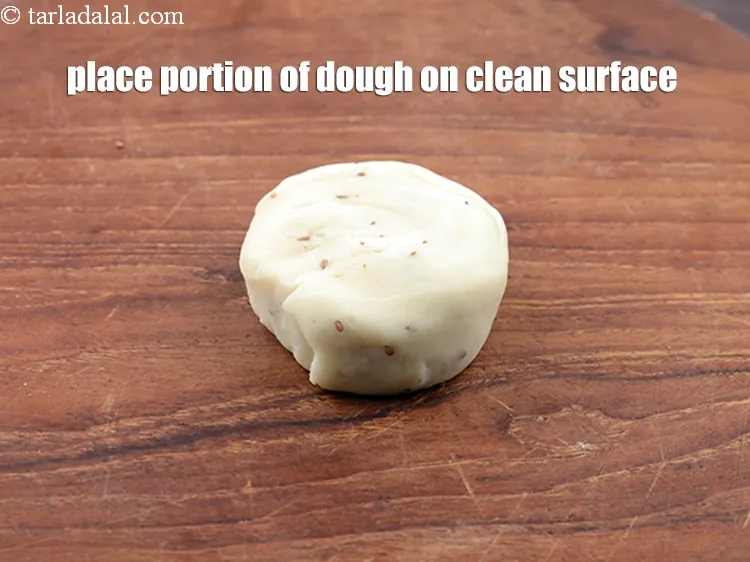 Step 23 – <p><span style="background-color:rgb(255,255,255);color:rgb(0,0,0);">Place a portion of the dough on a clean, dry surface.</span></p>