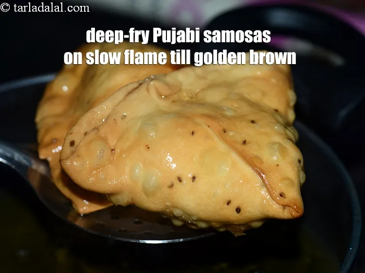 Step 32 – <p><span style="background-color:rgb(255,255,255);color:rgb(0,0,0);">Deep-fry the Punjabi samosas on a slow flame till they turn golden brown in …