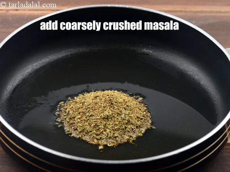 Step 10 – <p><span style="background-color:rgb(255,255,255);color:rgb(0,0,0);">Add the coarsely crushed </span><a href="https://www.tarladalal.com/glossary-coriander-seeds-dhania-ke-beej-dhania-seeds-akha-dhania-371i"><u>coriander (dhania) seeds</u></a>.</p>