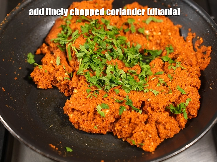 Step 38 – <p><span style="background-color:rgb(255,255,255);color:rgb(0,0,0);">Add 2 tbsp finely </span><a href="https://www.tarladalal.com/glossary-coriander-dhania-kothmir-369i#ing_2365"><u>chopped coriander (dhania)</u></a><u>.</u></p>