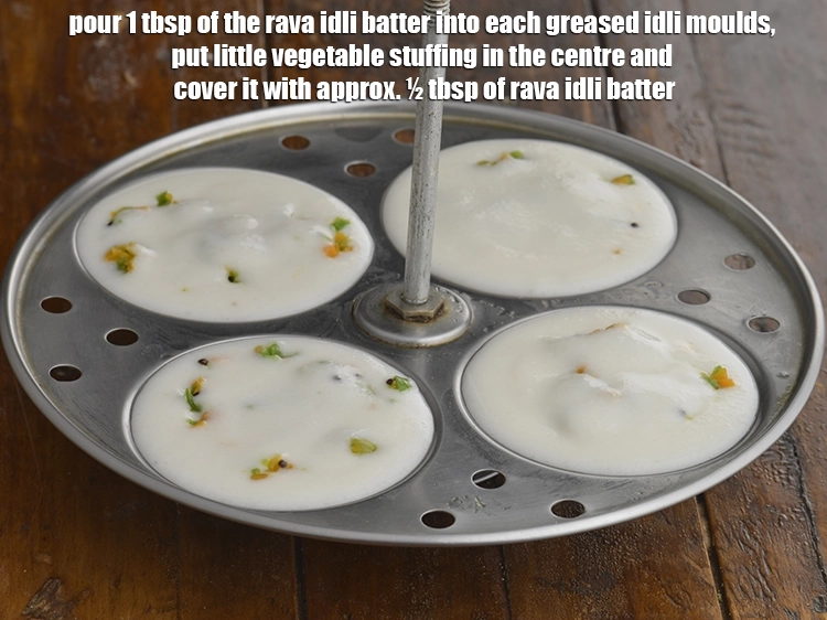 Step 6 – <p><span style="background-color:rgb(255,255,255);color:rgb(0,0,0);">Pour 1 tbsp of the rava idli batter into each greased idli moulds, put …