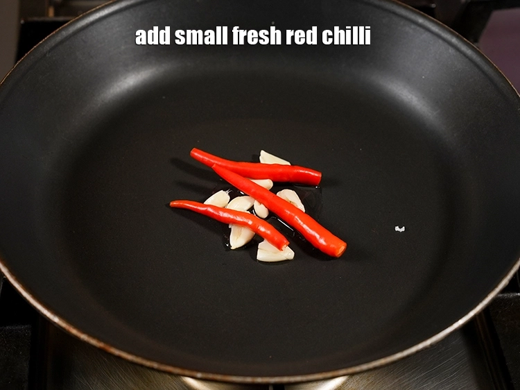 Step 4 – <p>Add <span style="background-color:rgb(255,255,255);color:rgb(0,0,0);">3 small </span><a href="https://www.tarladalal.com/glossary-fresh-red-chillies-lal-mirch-lal-mirchi-334i"><u>fresh red chilli</u></a><u>.</u></p>