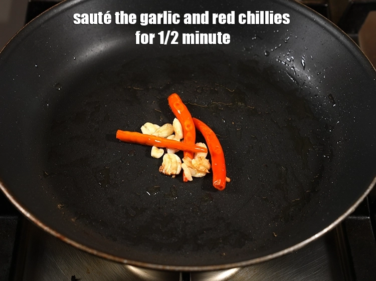 Step 5 – <p><span style="background-color:rgb(255,255,255);color:rgb(0,0,0);">Saute the garlic and red chillies for 1/2 minute.</span></p>