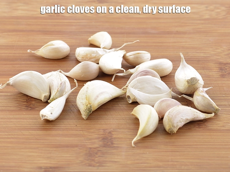 Step 7 – <p><span style="background-color:rgb(255,255,255);color:rgb(0,0,0);">First place the 10 to 12 </span><a href="https://www.tarladalal.com/glossary-garlic-lehsun-lahsun-348i#ing_2537"><u>garlic (lehsun) cloves</u></a><span style="background-color:rgb(255,255,255);color:rgb(0,0,0);"> on a clean, …