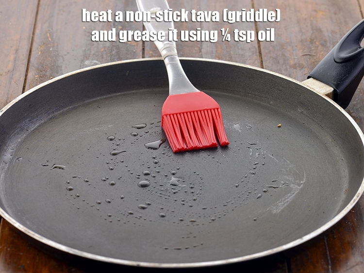 Step 13 – <p><span style="background-color:rgb(255,255,255);color:rgb(0,0,0);">Heat a non-stick tava (griddle) and grease it using ¼ tsp </span><a href="https://www.tarladalal.com/glossary-peanut-oil-groundnut-oil-sing-tel-920i"><u>peanut oil</u></a><span …