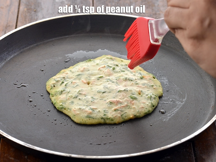 Step 15 – <p><span style="background-color:rgb(255,255,255);color:rgb(0,0,0);">Cook&nbsp;</span><strong>Vegetable Oats Pancake&nbsp;</strong><span style="background-color:rgb(255,255,255);color:rgb(0,0,0);">using ¼ tsp of </span><a href="https://www.tarladalal.com/glossary-peanut-oil-groundnut-oil-sing-tel-920i"><u>peanut oil</u></a>.</p>