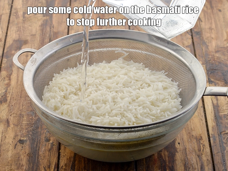 Step 10 – <p>Pour some cold water on the&nbsp;<strong>basmati rice</strong>&nbsp;to stop further cooking.&nbsp;Let all the water from the …