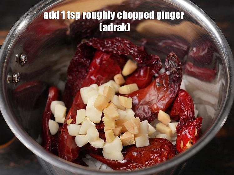 Step 13 – <p><span style="background-color:rgb(255,255,255);color:rgb(0,0,0);">Add 1 tsp roughly </span><a href="https://www.tarladalal.com/glossary-ginger-adrak-453i#ing_2366"><u>chopped ginger (adrak)</u></a><u>.</u></p>