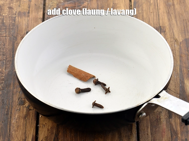 Step 10 – <p>Add <span style="background-color:rgb(255,255,255);color:rgb(0,0,0);">4 </span><a href="https://www.tarladalal.com/glossary-cloves-laung-lavang-322i"><u>clove (laung / lavang)</u></a>. The pungent taste balances the flavour of …