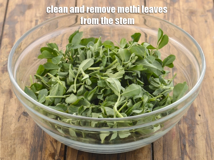 Step 16 – <p>Clean and remove <a href="https://www.tarladalal.com/glossary-fenugreek-leaves-methi-methi-leaves-methi-ke-patte-methi-ki-bhaji-373i#ing_2382"><u>fenugreek leaves (methi) </u></a><span style="background-color:rgb(255,255,255);color:rgb(0,0,0);">leaves</span> from the stem.</p>