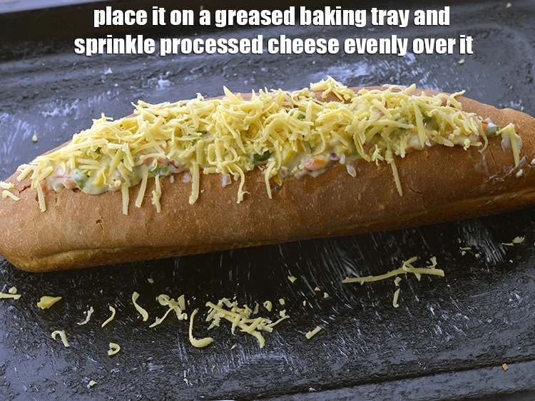 Step 8 – <p><span style="background-color:rgb(255,255,255);color:rgb(0,0,0);">Place it on a greased baking tray and sprinkle </span><a href="https://www.tarladalal.com/glossary-processed-cheese-315i#ing_3090"><u>grated processed cheese</u></a><span style="background-color:rgb(255,255,255);color:rgb(0,0,0);"> …