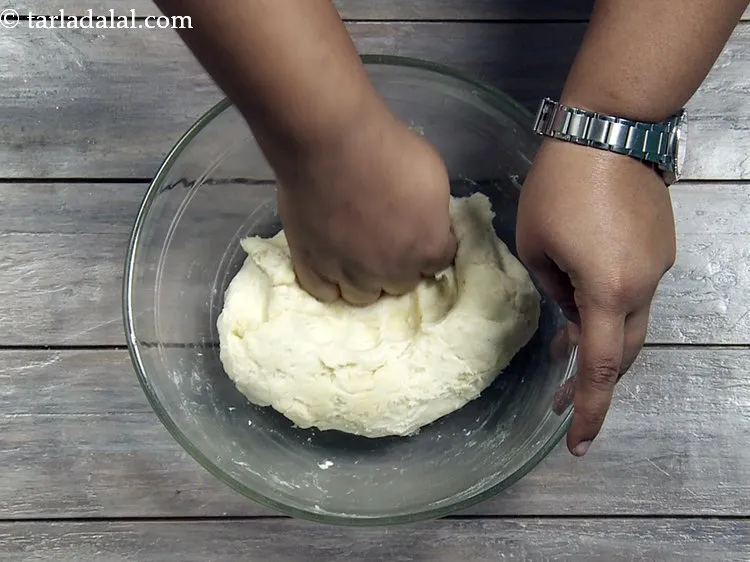 Step 22 – <p><span style="background-color:rgb(255,255,255);color:rgb(0,0,0);">Knead the dough again using your hands. You will feel that the dough has …