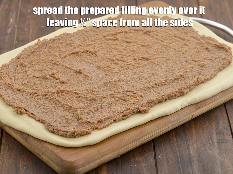 Step 24 – <p><span style="background-color:rgb(255,255,255);color:rgb(0,0,0);">Spread the <strong>prepared filling</strong> evenly over it leaving ½” space from all the sides.</span></p>