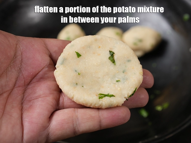 Step 14 – <p><span style="background-color:rgb(255,255,255);color:rgb(0,0,0);">Flatten a portion of the potato mixture in between your palms.</span></p>