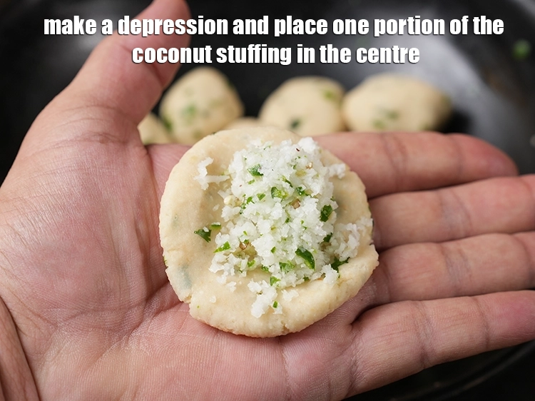 Step 15 – <p><span style="background-color:rgb(255,255,255);color:rgb(0,0,0);">Make a depression and place one portion of the <strong>coconut stuffing</strong> in the centre.</span></p>
