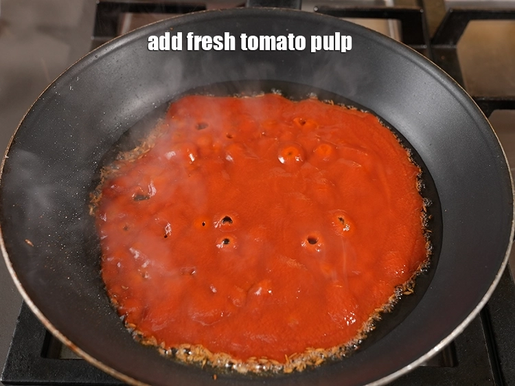 Step 24 – <p><span style="background-color:rgb(255,255,255);color:rgb(0,0,0);">When the seeds crackle, &nbsp;</span>Add <span style="background-color:rgb(255,255,255);color:rgb(0,0,0);">3/4 cup fresh </span><a href="https://www.tarladalal.com/glossary-tomatoes-tamatar-639i#ing_2756"><u>tomato pulp</u></a><u>.</u></p>