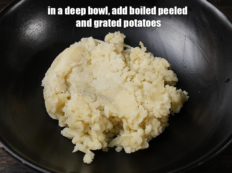 Step 7 – <p><span style="background-color:rgb(255,255,255);color:rgb(0,0,0);">In a deep bowl,&nbsp;add 1 cup </span><a href="https://www.tarladalal.com/glossary-potatoes-aloo-alu-batata-710i#ing_2617"><u>boiled peeled and grated potatoes</u></a>.</p>