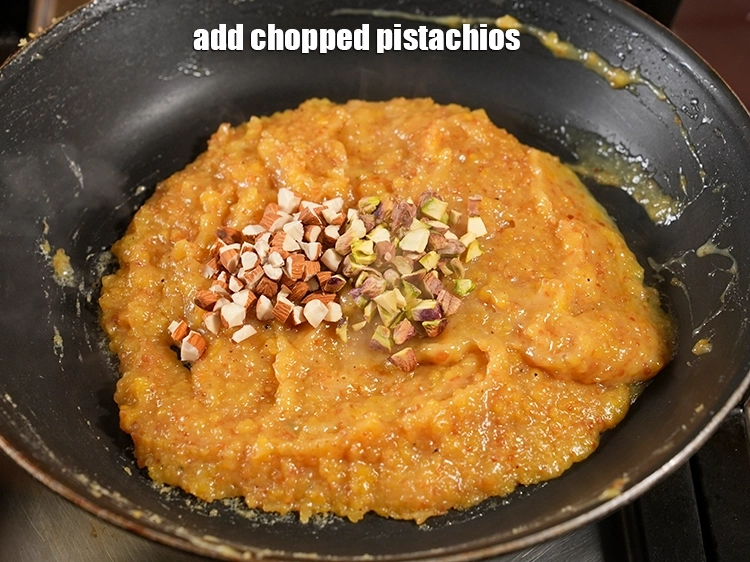 Step 22 – <p><span style="background-color:rgb(255,255,255);color:rgb(0,0,0);">Add 1 tbsp </span><a href="https://www.tarladalal.com/glossary-pistachios-pista-891i#ing_3236"><u>chopped pistachios</u></a><span style="background-color:rgb(255,255,255);color:rgb(0,0,0);">.</span></p>