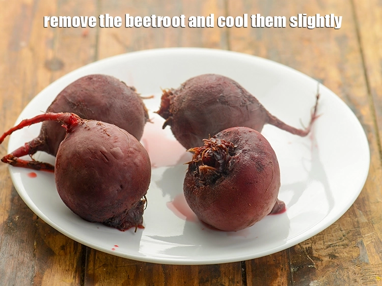 Step 13 – <p>Remove the <a href="https://www.tarladalal.com/glossary-beetroot-chukandar-201i#">beetroot</a> and cool them slightly.</p>
