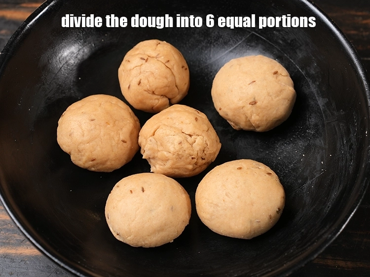 Step 12 – <p><span style="background-color:rgb(255,255,255);color:rgb(0,0,0);">To prepare <strong>khasta roti, </strong>divide the </span><span style="background-color:rgb(255,255,255);color:rgb(51,51,51);">dough in 6 equal medium sized balls.</span></p>