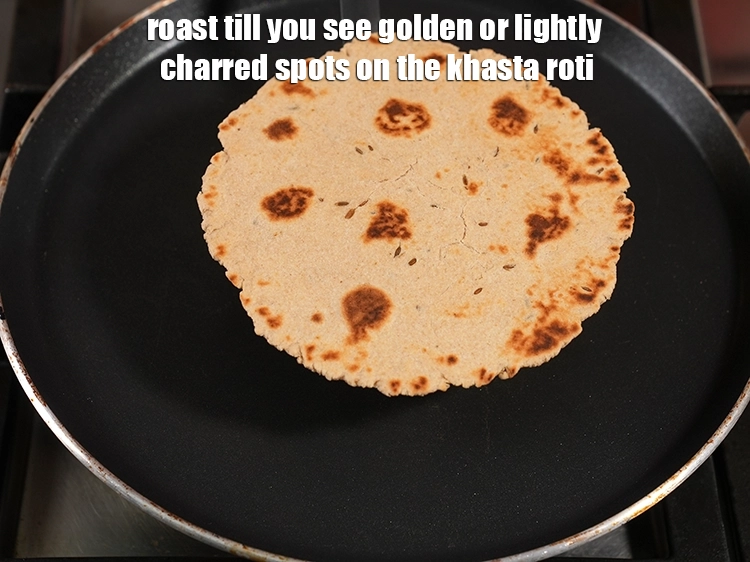 Step 18 – <p><span style="background-color:rgb(255,255,255);color:rgb(51,51,51);">Roast till you see golden or lightly charred spots on the <strong>khasta roti</strong>.</span></p>