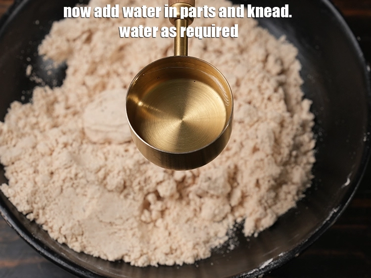 Step 9 – <p><span style="background-color:rgb(255,255,255);color:rgb(51,51,51);">Now add water in parts and knead.&nbsp;water as required.</span></p>
