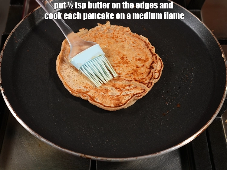 Step 15 – <html><head><meta charset="UTF-8"> </head><body><p>Put ½ tsp <a href="https://www.tarladalal.com/glossary-butter-makhan-233i#ing_3123"><u>butter</u></a> on the edges and cook each pancake on …