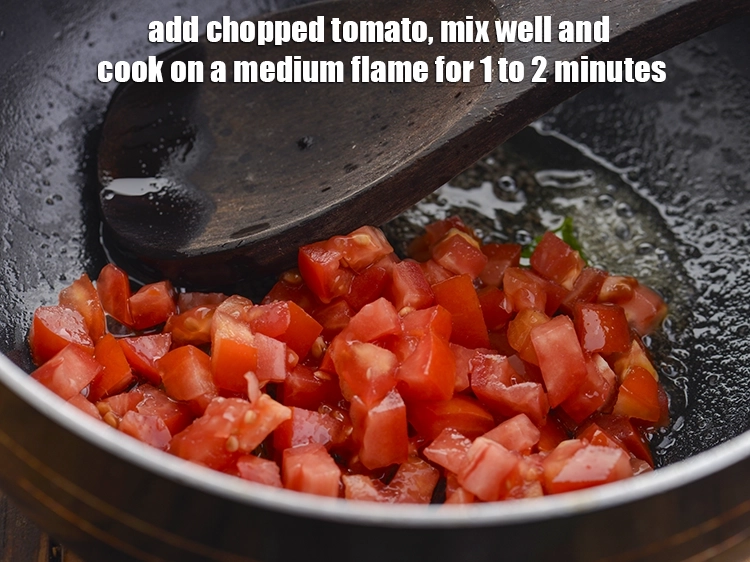 Step 25 – <p>Add the <span style="background-color:rgb(255,255,255);color:rgb(0,0,0);">1/2 cup </span><a href="https://www.tarladalal.com/glossary-tomatoes-tamatar-639i#ing_2361"><u>chopped tomato</u></a>. They provide a tangy flavour to the …