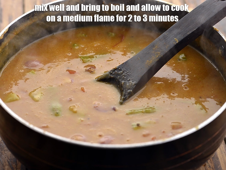 Step 34 – <p>Mix well and bring&nbsp;<strong>South Indian homemade Sambar&nbsp;</strong>to boil and allow to cook on a medium …