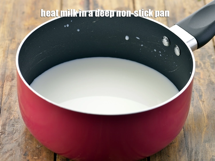 Step 4 – <p><span style="color:rgb(13,13,13);">Heat the </span><a href="https://www.tarladalal.com/glossary-milk-doodh-full-cream-milk-514i"><u>milk</u></a><span style="color:rgb(13,13,13);"> in a deep non-stick pan.</span></p>