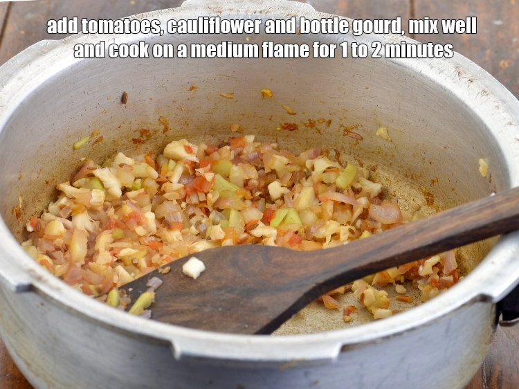 Step 4 – <p><span style="color:rgb(13,13,13);">Add the </span><span style="background-color:rgb(255,255,255);color:rgb(0,0,0);">1/4 cup finely </span><a href="https://www.tarladalal.com/glossary-tomatoes-tamatar-639i#ing_2361"><u>chopped tomato</u></a><span style="color:rgb(13,13,13);">, </span><span style="background-color:rgb(255,255,255);color:rgb(0,0,0);">1/4 cup finely …