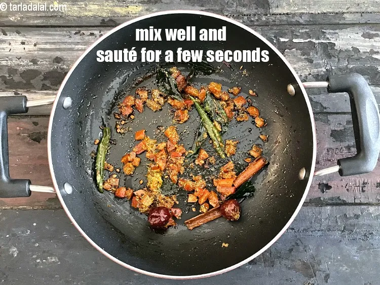 Step 34 – <p>Mix well and sauté on a medium flame for few seconds.</p>