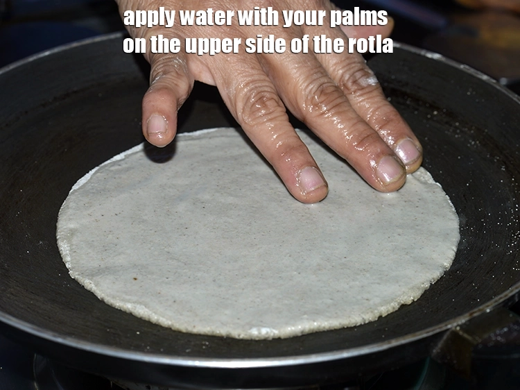 Step 15 – <p>Heat a non-stick tava (griddle) on a high flame and when hot, place the <strong>rotla</strong> …