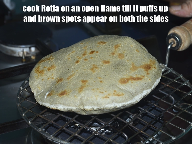 Step 17 – <p>Cook&nbsp;<strong>Bajra Na Rotla&nbsp;</strong>on an open flame till it puffs up and brown spots appear on …