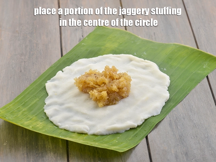 Step 11 – <p><span style="color:rgb(13,13,13);">Place a portion of the <strong>jaggery stuffing</strong> in the centre of the circle.</span></p>