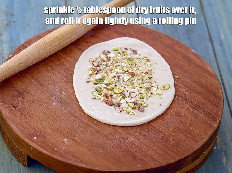 Step 15 – <p><span style="background-color:rgb(255,255,255);color:rgb(0,0,0);">Sprinkle ½ tablespoon of finely </span><a href="https://www.tarladalal.com/glossary-dry-fruits-sukhe-meve-396i#ing_3254"><u>chopped dried fruits </u></a><span style="background-color:rgb(255,255,255);color:rgb(0,0,0);">( almonds , pistachio …