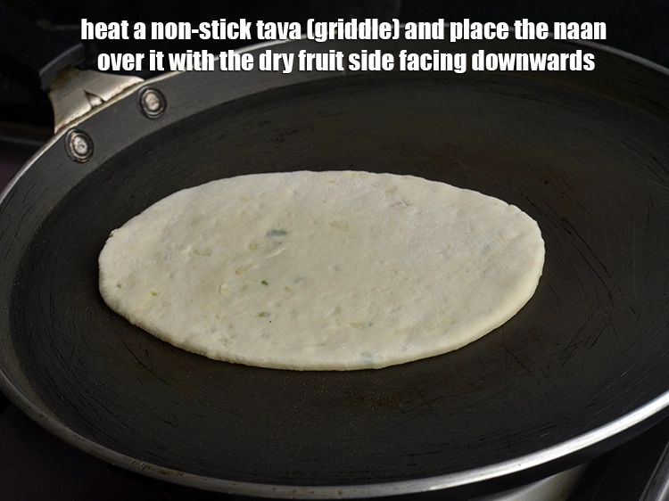 Step 16 – <p><span style="background-color:rgb(255,255,255);color:rgb(0,0,0);">Heat a non-stick tava (griddle) and place the naan over it with the dry …