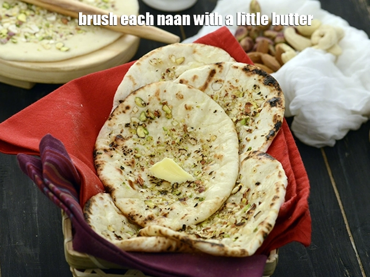 Step 19 – <p><span style="background-color:rgb(255,255,255);color:rgb(0,0,0);">Brush each naan with a little </span><a href="https://www.tarladalal.com/glossary-butter-makhan-233i#ing_3123"><u>melted butter</u></a><span style="background-color:rgb(255,255,255);color:rgb(0,0,0);">.</span></p>