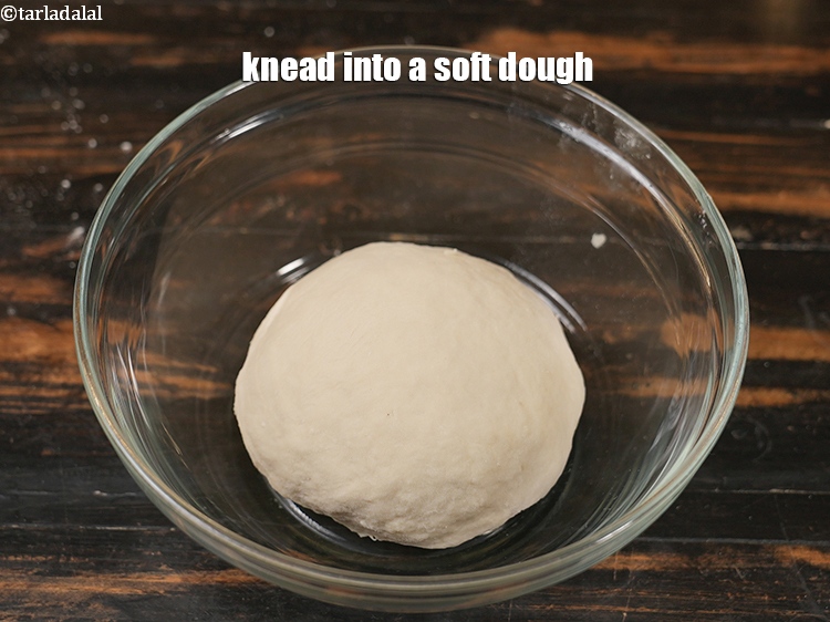 Step 9 – <p><span style="background-color:rgb(255,255,255);color:rgb(0,0,0);">Knead into a soft dough, using enough water.</span></p>