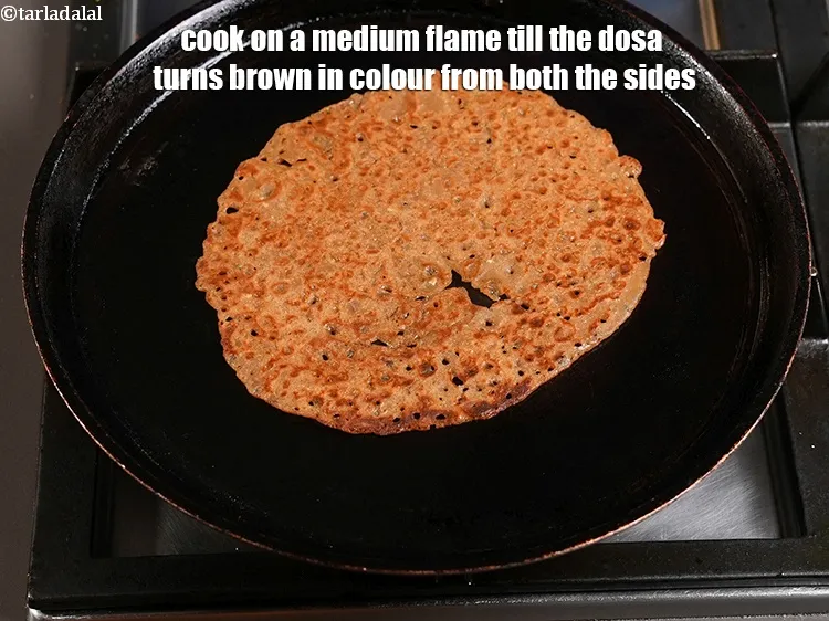 Step 16 – <p>Cook on a medium flame till the dosa turns brown in colour from both the …