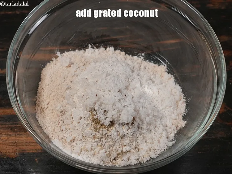 Step 9 – <p>Add 2 tbsp grated <a href="https://www.tarladalal.com/glossary-coconut-nariyal-269i">coconut</a>.&nbsp;</p>