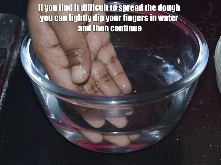 Step 18 – <p><span style="background-color:rgb(255,255,255);color:rgb(0,0,0);">If you find it difficult to spread the dough you can lightly dip your …